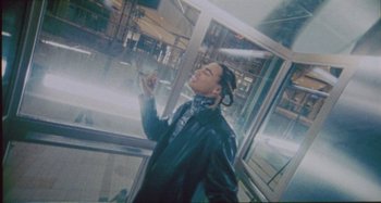 Movie still from “24kGoldn & Lil Tecca - Prada” (2021), directed by John Tashiro – Medium shot, Low angle