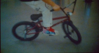 Movie still from “24kGoldn & Lil Tecca - Prada” (2021), directed by John Tashiro – Wide shot, High angle