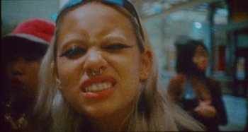 Movie still from “24kGoldn & Lil Tecca - Prada” (2021), directed by John Tashiro – Close Up shot, High angle