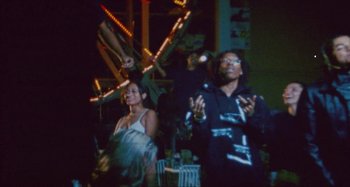 Movie still from “24kGoldn & Lil Tecca - Prada” (2021), directed by John Tashiro – Medium shot, Low angle