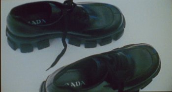 Movie still from “24kGoldn & Lil Tecca - Prada” (2021), directed by John Tashiro – Extreme Close Up shot, Overhead angle