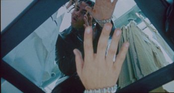 Movie still from “24kGoldn & Lil Tecca - Prada” (2021), directed by John Tashiro – Extreme Close Up shot, Low angle