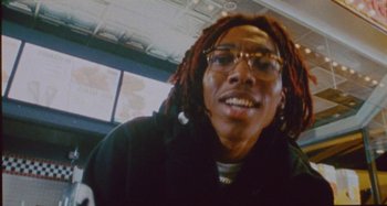 Movie still from “24kGoldn & Lil Tecca - Prada” (2021), directed by John Tashiro – Close Up shot, Low angle