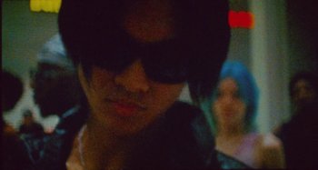 Movie still from “24kGoldn & Lil Tecca - Prada” (2021), directed by John Tashiro – Extreme Close Up shot, Low angle