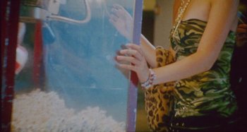 Movie still from “24kGoldn & Lil Tecca - Prada” (2021), directed by John Tashiro – Medium shot, High angle