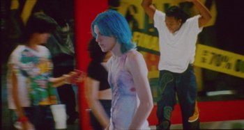 Movie still from “24kGoldn & Lil Tecca - Prada” (2021), directed by John Tashiro – Medium shot, Low angle