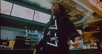 Movie still from “24kGoldn & Lil Tecca - Prada” (2021), directed by John Tashiro – Medium shot, Low angle