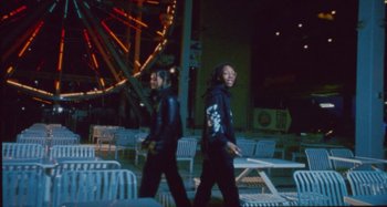 Movie still from “24kGoldn & Lil Tecca - Prada” (2021), directed by John Tashiro – Medium shot, Low angle