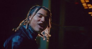 Movie still from “24kGoldn & Lil Tecca - Prada” (2021), directed by John Tashiro – Close Up shot, Low angle