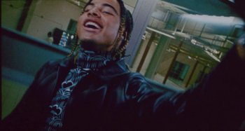 Movie still from “24kGoldn & Lil Tecca - Prada” (2021), directed by John Tashiro – Close Up shot, Low angle