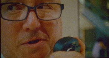 Movie still from “24kGoldn & Lil Tecca - Prada” (2021), directed by John Tashiro – Extreme Close Up shot, High angle