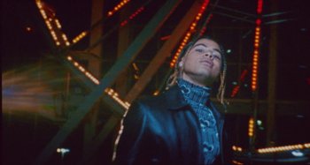 Movie still from “24kGoldn & Lil Tecca - Prada” (2021), directed by John Tashiro – Medium shot, Low angle