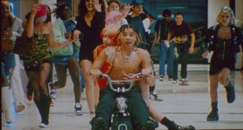 Movie still from “24kGoldn & Lil Tecca - Prada” (2021), directed by John Tashiro – Wide shot, High angle