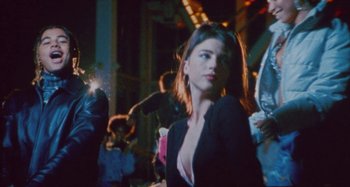 Movie still from “24kGoldn & Lil Tecca - Prada” (2021), directed by John Tashiro – Medium shot, Low angle