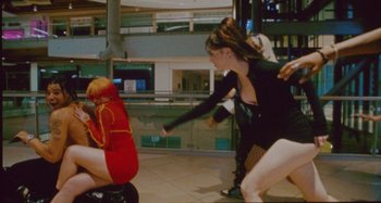 Movie still from “24kGoldn & Lil Tecca - Prada” (2021), directed by John Tashiro – Medium shot, High angle