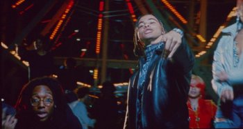 Movie still from “24kGoldn & Lil Tecca - Prada” (2021), directed by John Tashiro – Medium shot, Low angle