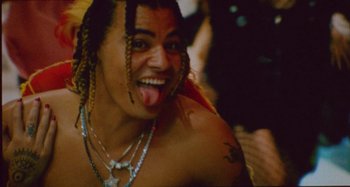 Movie still from “24kGoldn & Lil Tecca - Prada” (2021), directed by John Tashiro – Close Up shot, Low angle