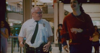 Movie still from “24kGoldn & Lil Tecca - Prada” (2021), directed by John Tashiro – Medium shot, Low angle