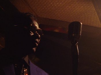 Movie still from “Earth, Wind & Fire - You Want My Love” (2021), directed by Andrew Litten – Close Up shot, Low angle