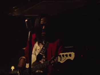 Movie still from “Earth, Wind & Fire - You Want My Love” (2021), directed by Andrew Litten – Medium shot, Low angle