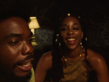 Movie still from “Earth, Wind & Fire - You Want My Love” (2021), directed by Andrew Litten – Close Up shot, Over the shoulder angle
