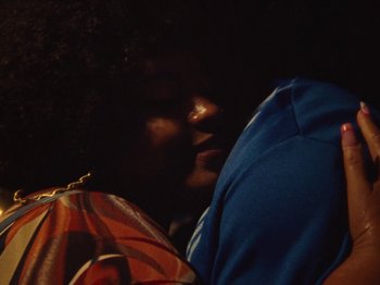 Movie still from “Earth, Wind & Fire - You Want My Love” (2021), directed by Andrew Litten – Extreme Close Up shot, Over the shoulder angle