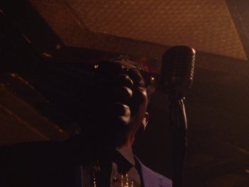 Movie still from “Earth, Wind & Fire - You Want My Love” (2021), directed by Andrew Litten – Extreme Close Up shot, Low angle