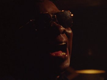 Movie still from “Earth, Wind & Fire - You Want My Love” (2021), directed by Andrew Litten – Extreme Close Up shot, Low angle