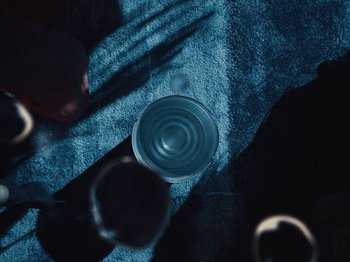 Movie still from “Earth, Wind & Fire - You Want My Love” (2021), directed by Andrew Litten – Extreme Close Up shot, Overhead angle