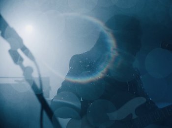 Movie still from “Earth, Wind & Fire - You Want My Love” (2021), directed by Andrew Litten – Extreme Close Up shot, Low angle
