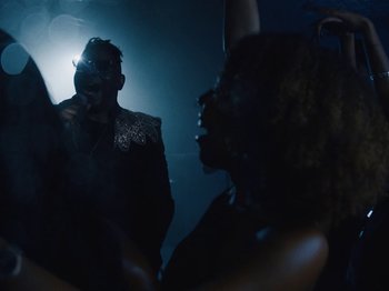 Movie still from “Earth, Wind & Fire - You Want My Love” (2021), directed by Andrew Litten – Medium shot, Low angle