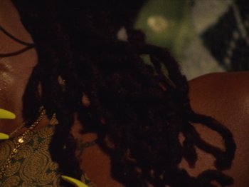 Movie still from “Earth, Wind & Fire - You Want My Love” (2021), directed by Andrew Litten – Extreme Close Up shot, Over the shoulder angle