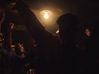 Movie still from “Earth, Wind & Fire - You Want My Love” (2021), directed by Andrew Litten – Medium shot, Low angle