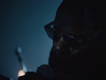 Movie still from “Earth, Wind & Fire - You Want My Love” (2021), directed by Andrew Litten – Extreme Close Up shot, Low angle