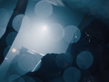Movie still from “Earth, Wind & Fire - You Want My Love” (2021), directed by Andrew Litten – Extreme Close Up shot, Low angle