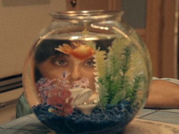 Movie still from “Blue Wilson - Underwater Dance” (2021), directed by Gabriel Jace Long – Extreme Close Up shot, High angle