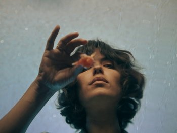 Movie still from “Blue Wilson - Underwater Dance” (2021), directed by Gabriel Jace Long – Extreme Close Up shot, Low angle