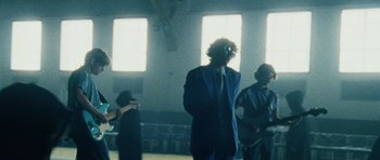 Movie still from “Almost Monday - Cool Enough” (2021), directed by Nico Poalillo – Medium shot, Low angle