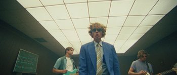 Movie still from “Almost Monday - Cool Enough” (2021), directed by Nico Poalillo – Medium shot, Low angle