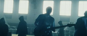 Movie still from “Almost Monday - Cool Enough” (2021), directed by Nico Poalillo – Medium shot, Low angle