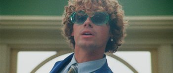 Movie still from “Almost Monday - Cool Enough” (2021), directed by Nico Poalillo – Close Up shot, Low angle