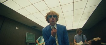 Movie still from “Almost Monday - Cool Enough” (2021), directed by Nico Poalillo – Medium shot, Low angle