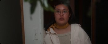 Movie still from “Amanda Sum - Hot Headed Egos” (2021), directed by Hannah Dubois – Medium shot, Low angle