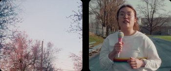 Movie still from “Amanda Sum - Hot Headed Egos” (2021), directed by Hannah Dubois – Medium shot, Low angle