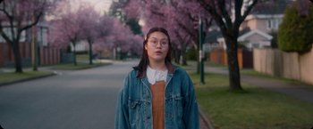 Movie still from “Amanda Sum - Hot Headed Egos” (2021), directed by Hannah Dubois – Medium shot, Low angle