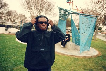 Movie still from “Huey Briss & Nikobeats - Grace Park Legend” (2021), directed by Michael Priestley – Medium shot, Low angle