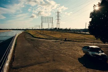 Movie still from “Huey Briss & Nikobeats - Grace Park Legend” (2021), directed by Michael Priestley – Extreme Wide shot, Low angle