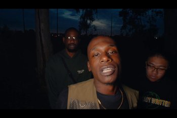 Movie still from “Huey Briss & Nikobeats - Grace Park Legend” (2021), directed by Michael Priestley – Medium shot, Low angle