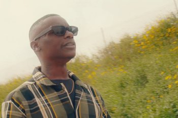 Movie still from “Huey Briss & Nikobeats - Grace Park Legend” (2021), directed by Michael Priestley – Close Up shot, Low angle