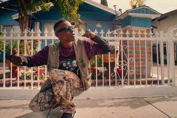 Movie still from “Huey Briss & Nikobeats - Grace Park Legend” (2021), directed by Michael Priestley – Medium shot, Low angle